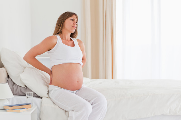 Болит промежность, мышцы живота и между ног во время беременности: почему возникает боль на ранних и поздних сроках?